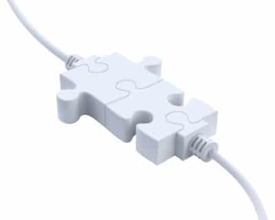 Two plugs that look like jigsaw puzzle pieces fitting together