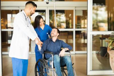 Patient leaving the hospital on a wheelchair