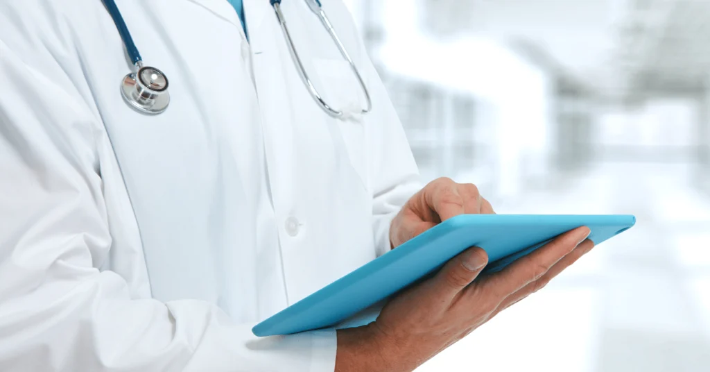 Doctor hands with tablet computer