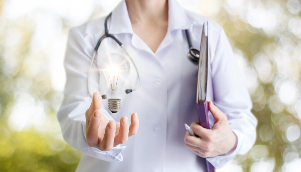 Doctor holding lightbulb