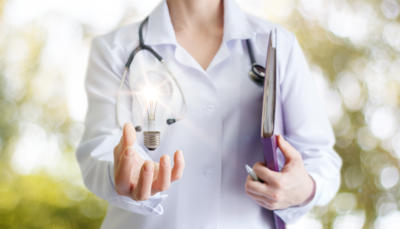 Doctor holding lightbulb