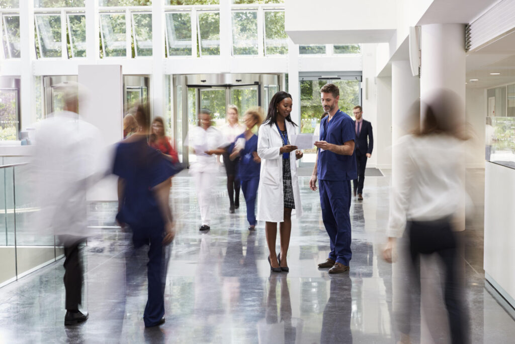 Staff In Busy Lobby Area