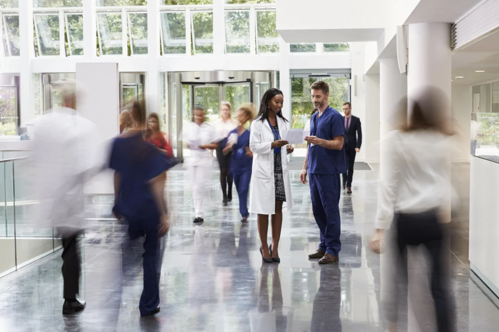Staff In Busy Lobby Area