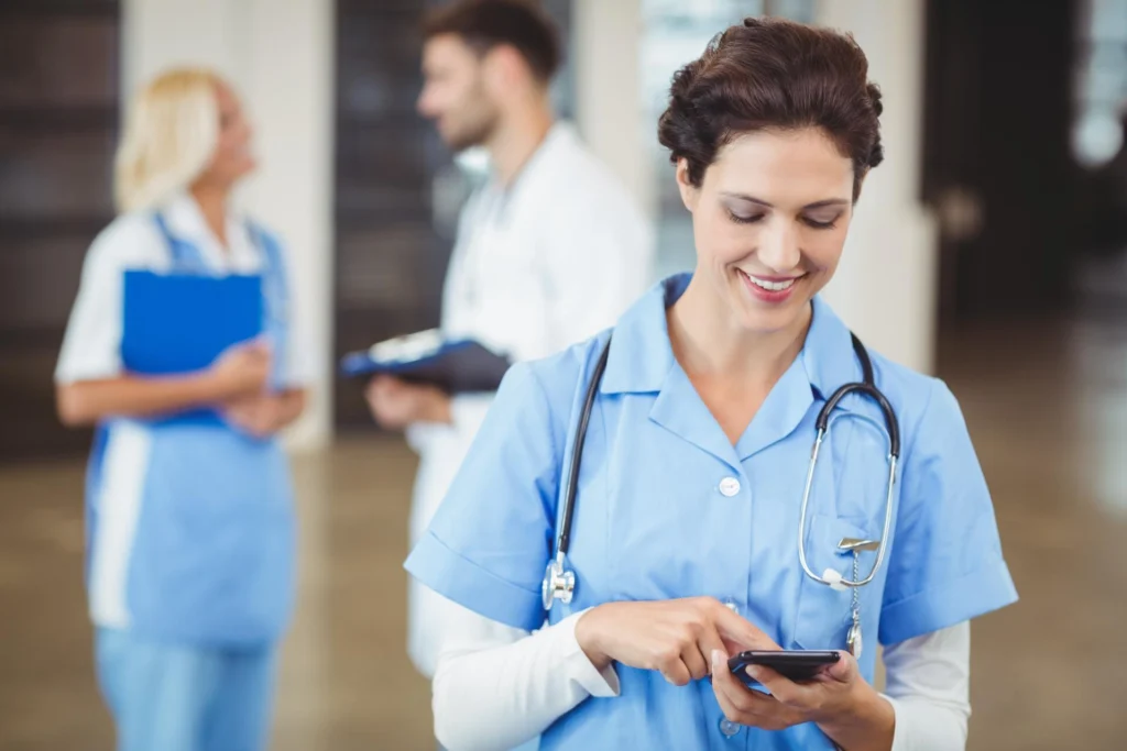 Nurse using mobile phone